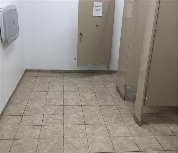 image of same commercial restroom after it has been fully cleaned and sanitized