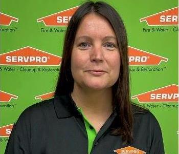 woman in front of Servpro backdrop