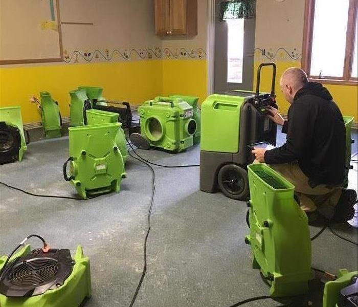 SERVPRO equipment is drying a room.